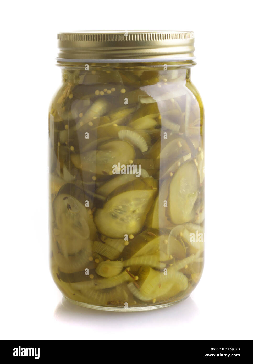 Pickled Cucumber in a sealed glass jar isolated on white background. Stock Photo