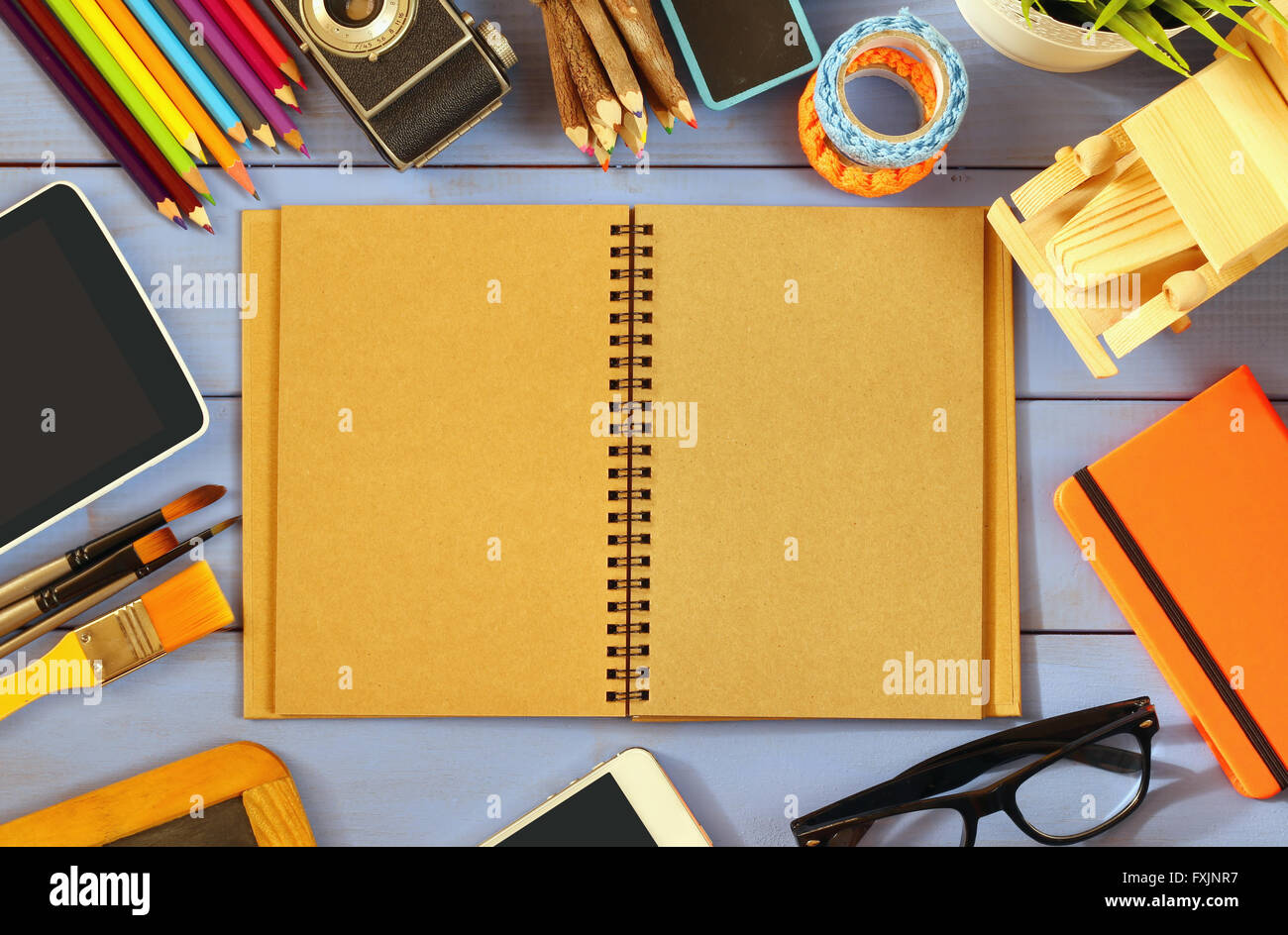 top view photo of blank notebook, old camera and school supplies on ...