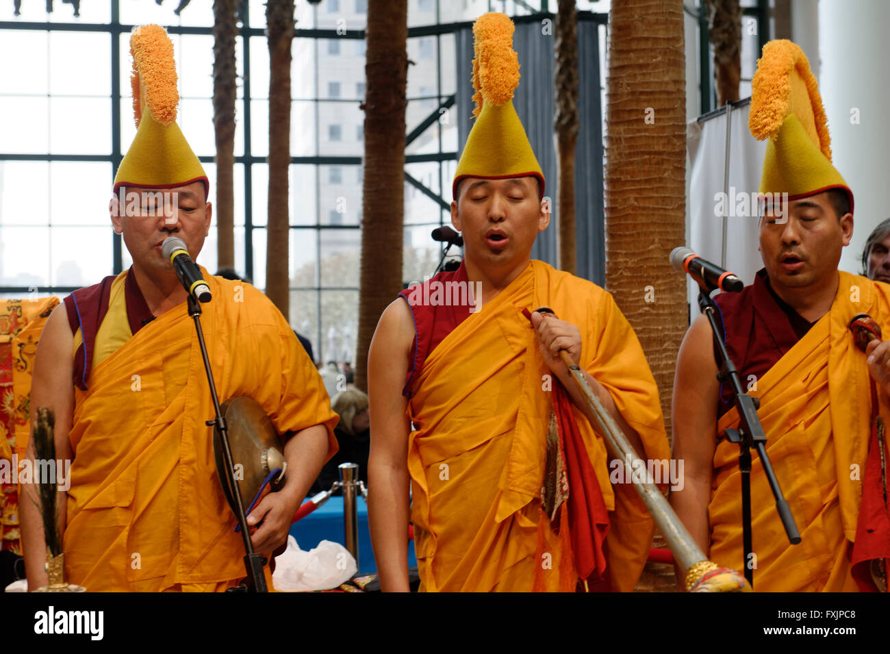 Buddhist monks from the Drepung Loseling Monastery chanting and playing instruments at the Winter Garden in Battery Park City. Stock Photo