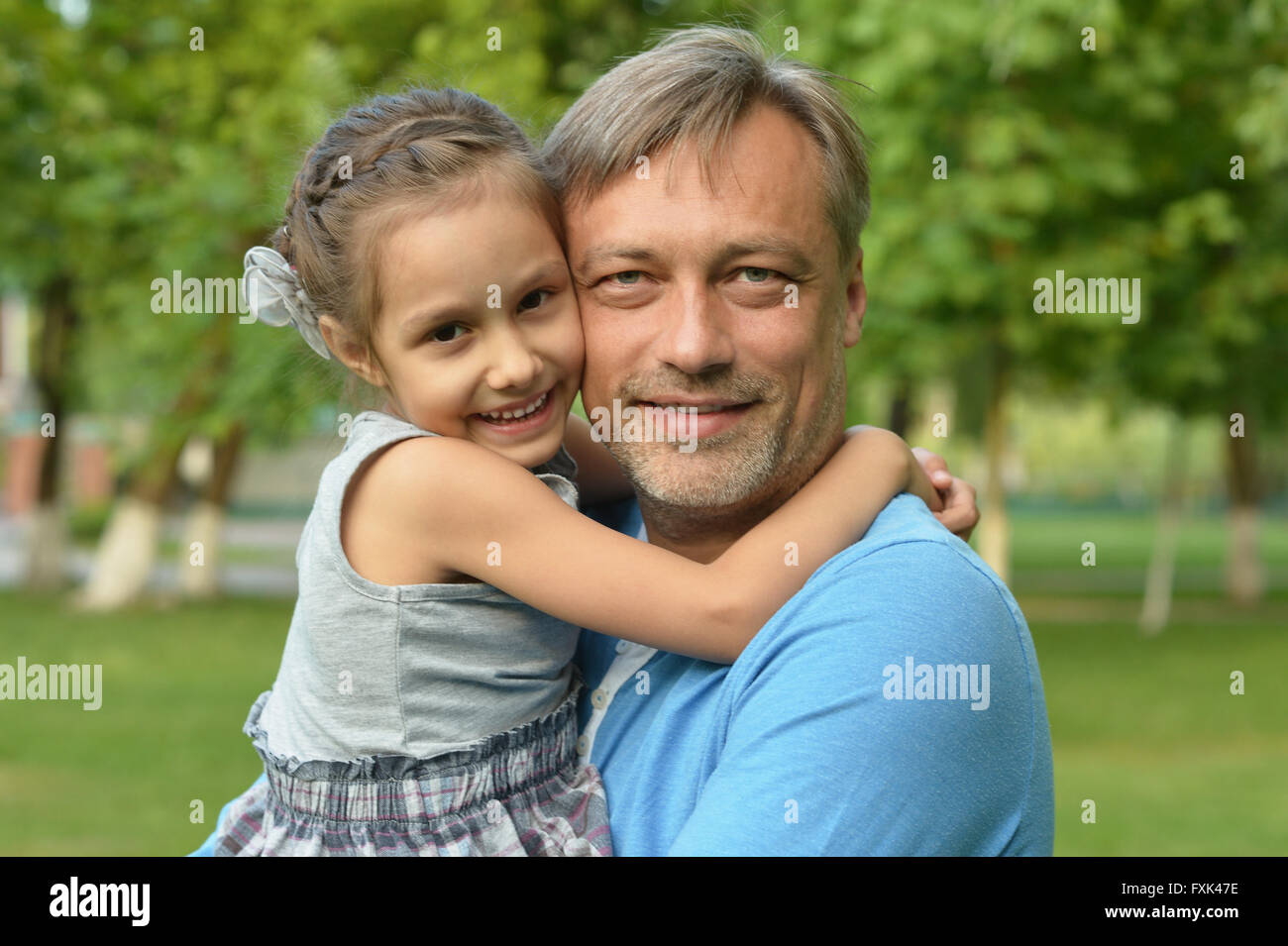 father with daughter in summer park Stock Photo - Alamy