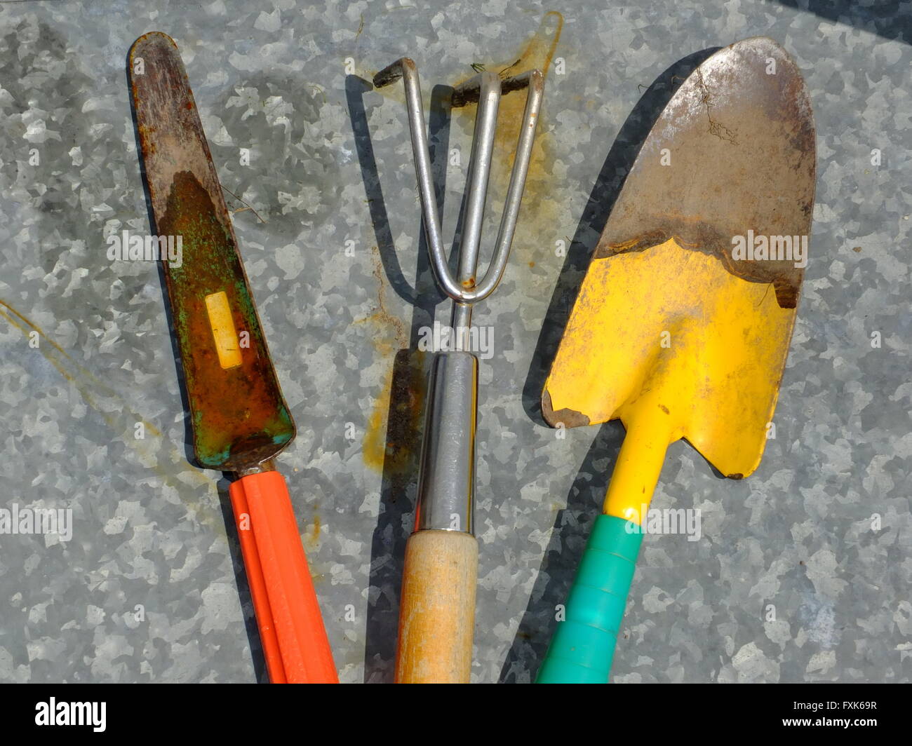 Colourful garden tools, rake, trowel Stock Photo Alamy