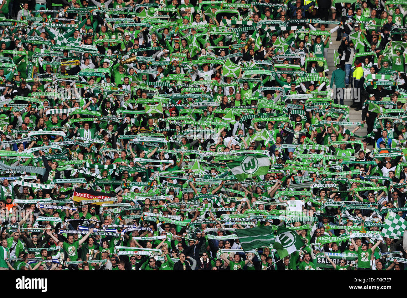 Wolfsburg football fans with scarves, banners in DFB match, Olympic Stadium, Berlin, Germany Stock Photo