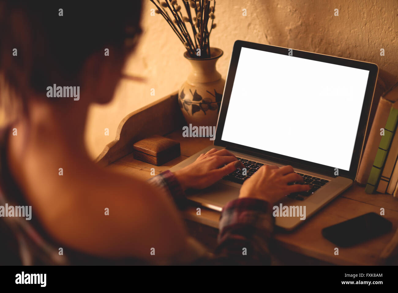 Young woman using laptop Stock Photo - Alamy