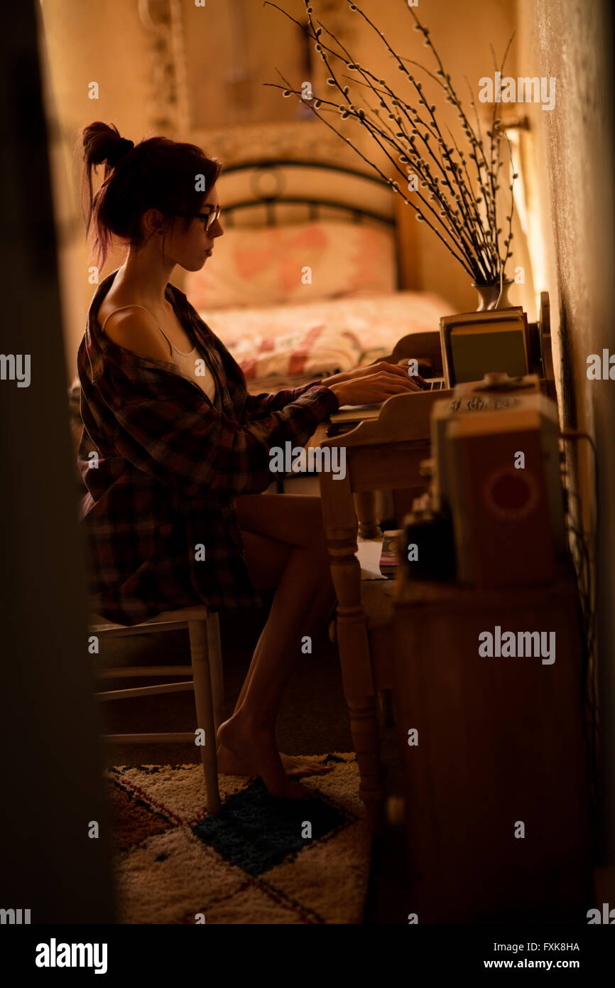 Young woman using laptop Stock Photo - Alamy