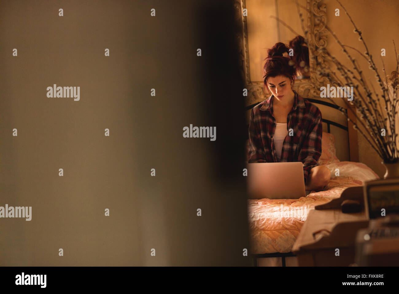 Young woman using laptop Stock Photo - Alamy