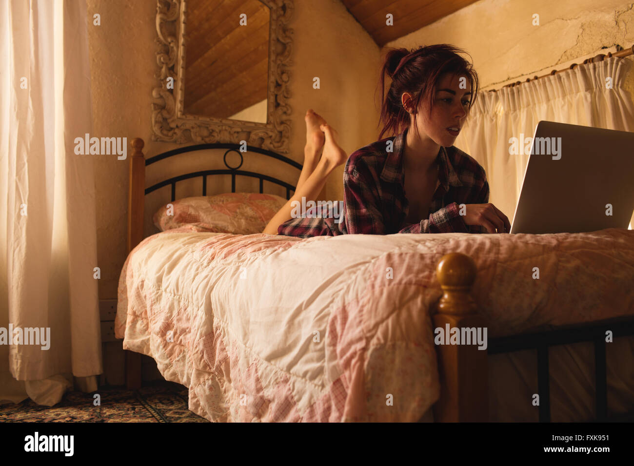 Young woman using laptop Stock Photo - Alamy