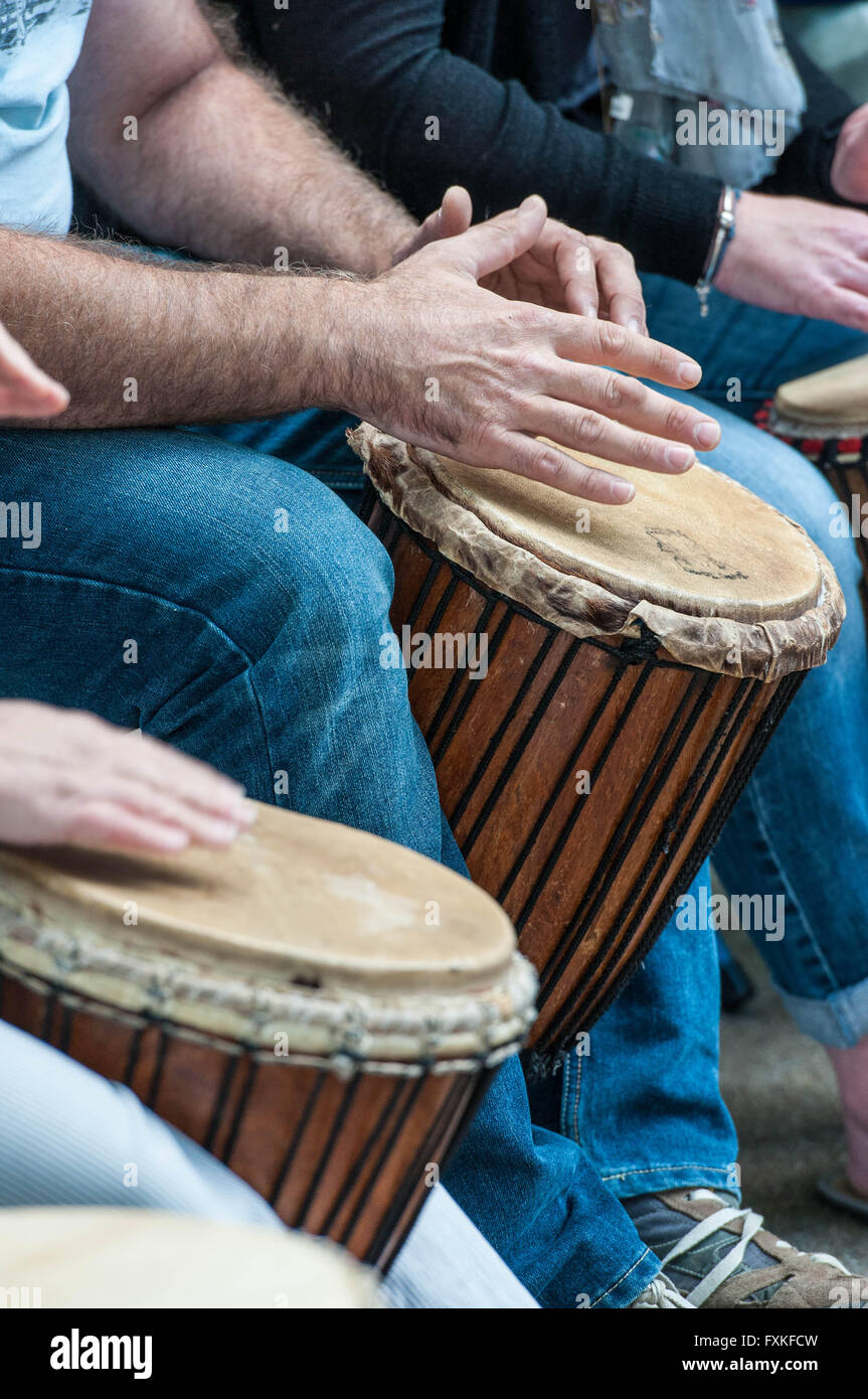 Group of people learn to play bongo drums Stock Photo Alamy