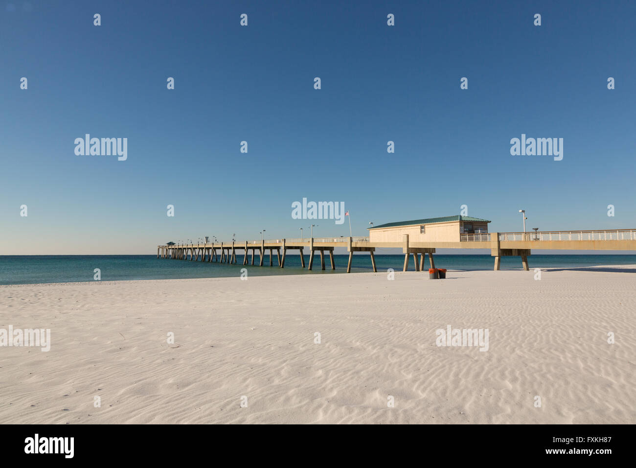 Okaloosa Island Pier along an empty beach in Fort Walton Beach, Florida. Stock Photo