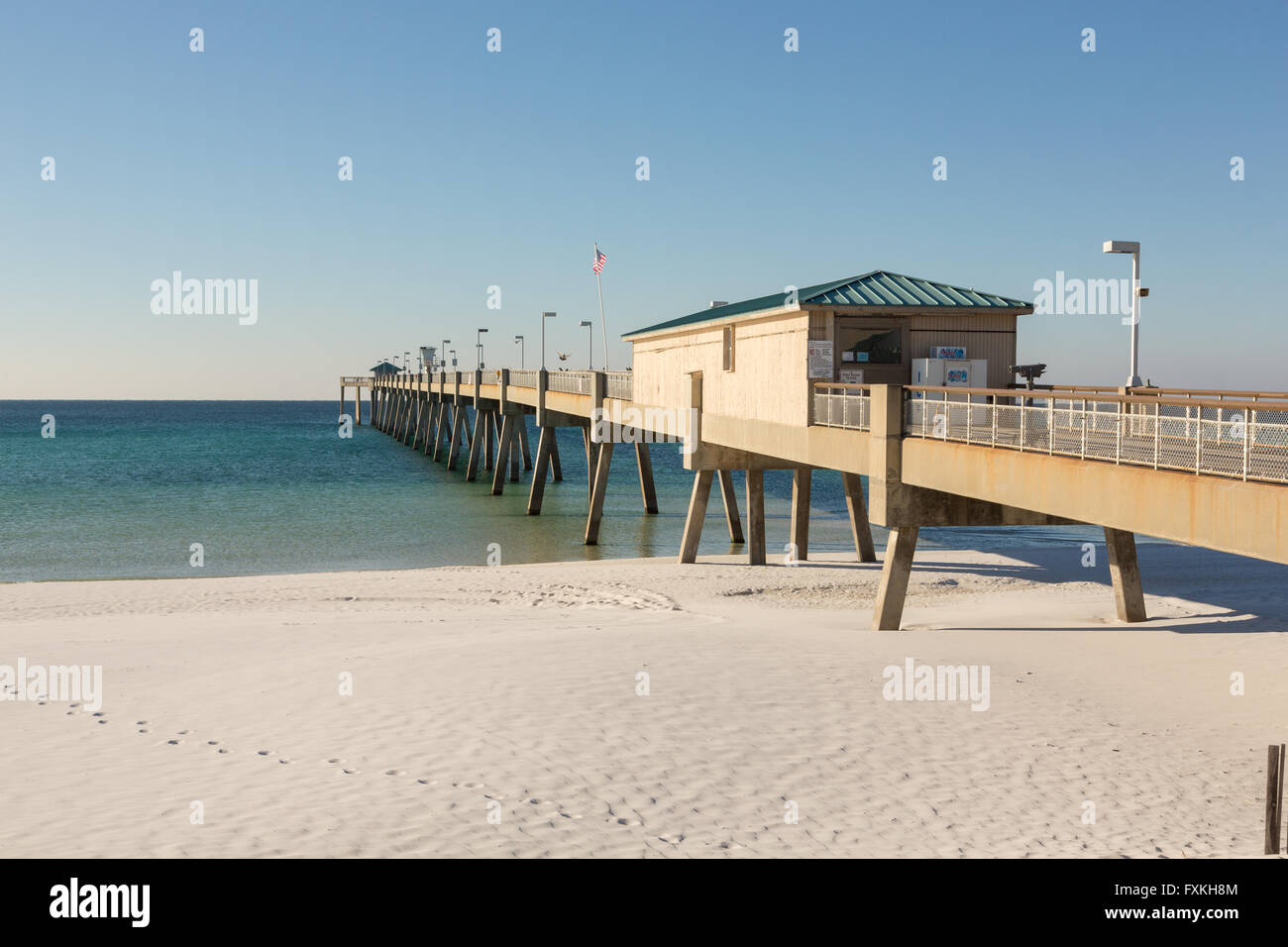 Okaloosa Island Pier along an empty beach in Fort Walton Beach, Florida. Stock Photo