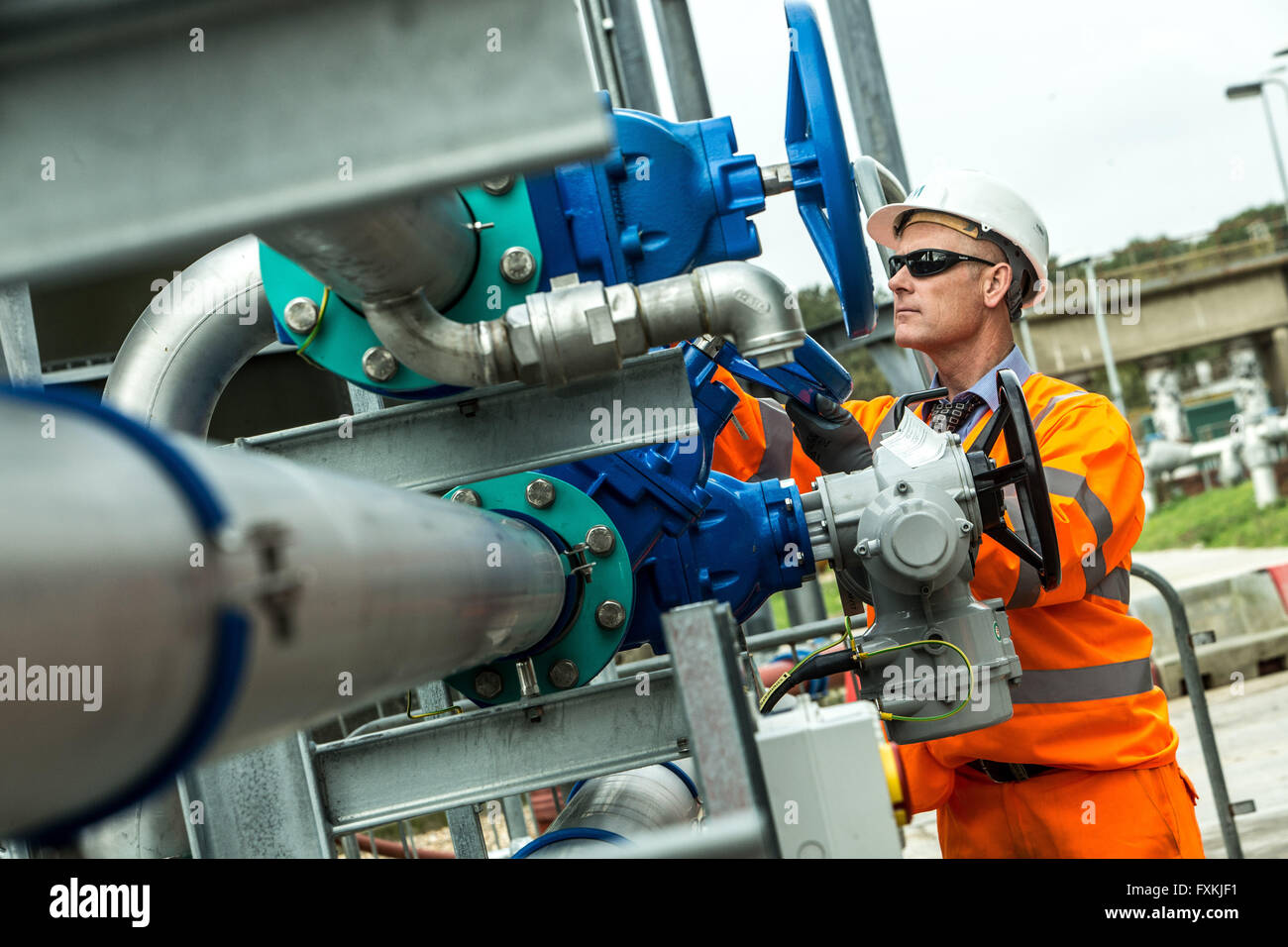 Water worker on site in waste water treatment works Stock Photo - Alamy