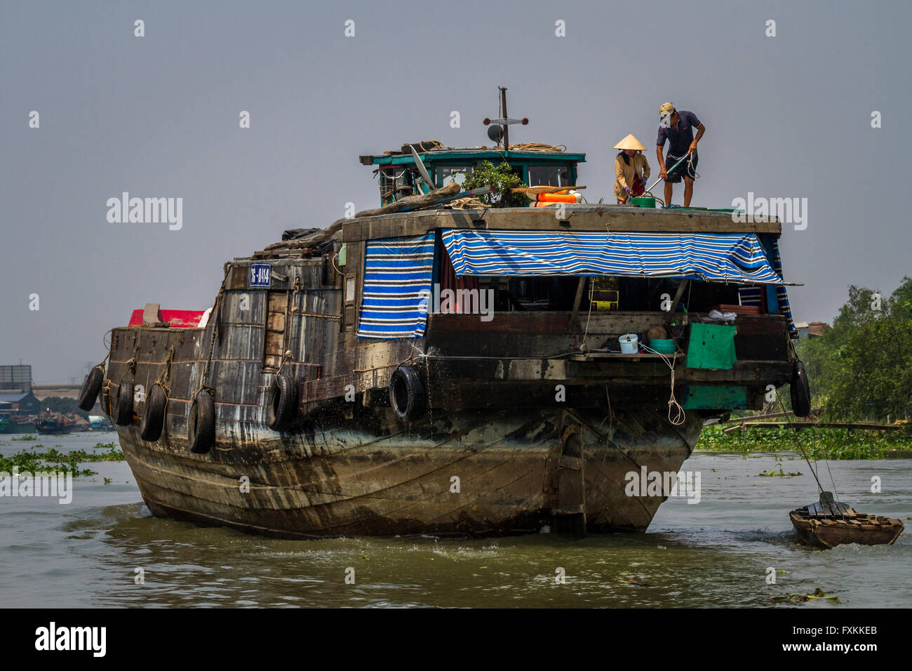 Life on the river, people on a traditional goods boat Chau Doc