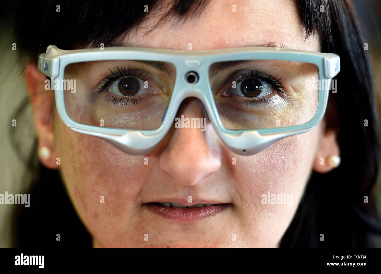 Maja Knezovic wearing special glasses for so-called eye tracking at the Vinn:Lab at the technical college in Wildau, Germany, 30 March 2016. Together with Klaus Grachmann, she wants to test how well a website can be read. The Vinn:Lab is a creative lab of TH Wildau and part of worldwide Fab Labs, short for 'Fabrication Laboratory'. It is often described as a form of open workshop. Photo: Britta Perdsen/dpa Stock Photo