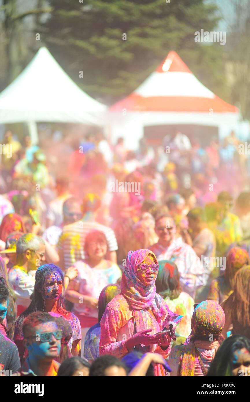 London, Ontario, Canada  16 April 2016. Hundreds of people gather in Victoria Park for the annual Hindu Holi celebration in London, Ontario. Holi is known as the festival of colours and sees participants throwing coloured powder into the air to celebrate the advent of spring. Credit:  Jonny White/Alamy Live News Stock Photo