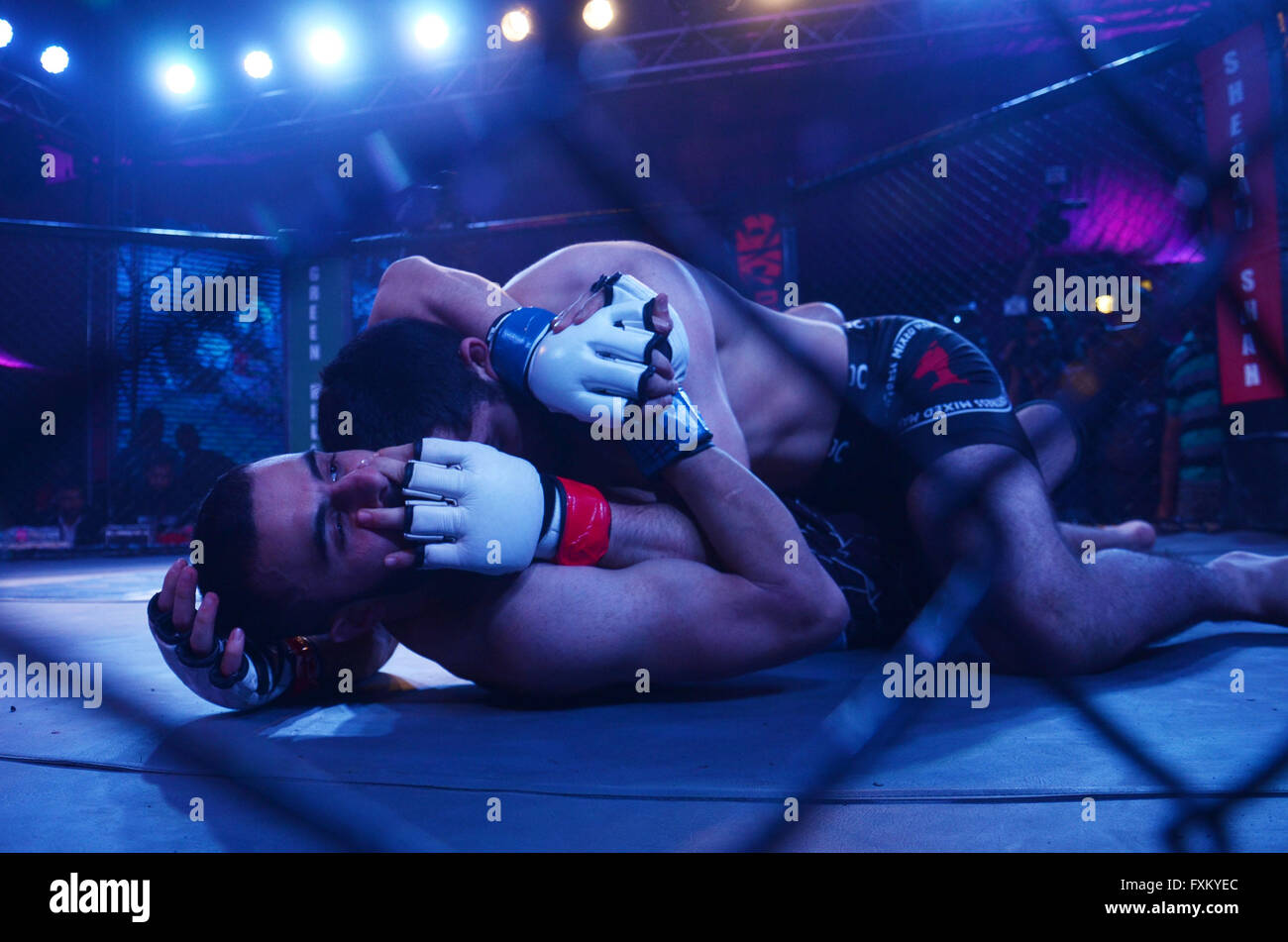 Lahore, Pakistan. 16th Apr, 2016. A view of the Pakistan kick boxing championship for the first time in Pakistan. Mehmosh Raza of Iran attack on Haroon Sohail of Pakistan during Pakistan kick boxing championship in Lahore. Pak MMA fighting alliance club held this championship for promoting kick fighting in Pakistan and for the first time invite players throughout subcontinent in Pakistan. © Rana Sajid Hussain/Pacific Press/Alamy Live News Stock Photo