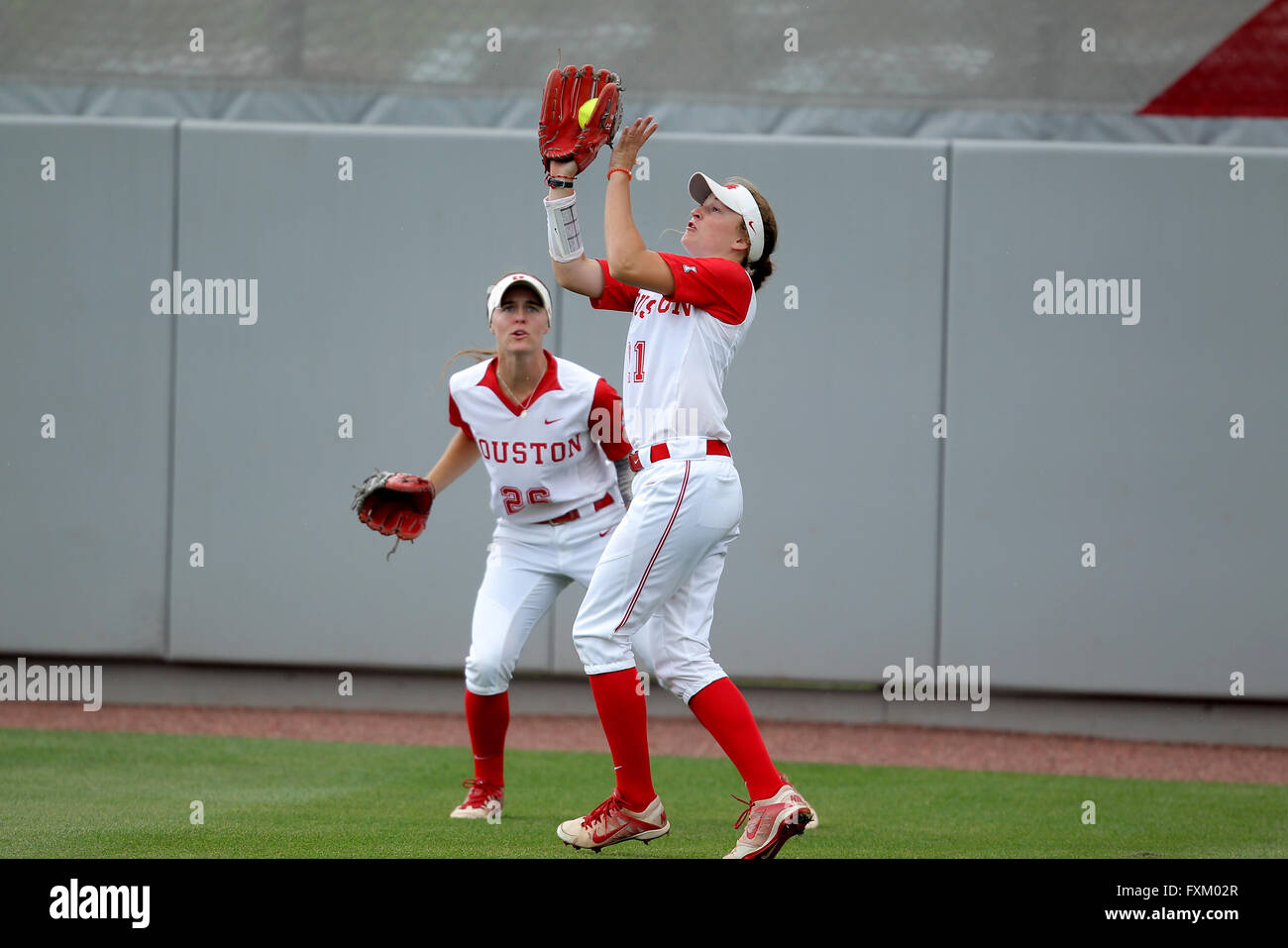 Houston, TX, USA. 16th Apr, 2016. Houston right fielder Elise LeBeouf #21 catches a fly ball for an out during the NCAA softball game between Houston and Central Florida from Cougar Softball Stadium in Houston, TX. UCF won, 8-3. Credit image: Erik Williams/Cal Sport Media/Alamy Live News Stock Photo