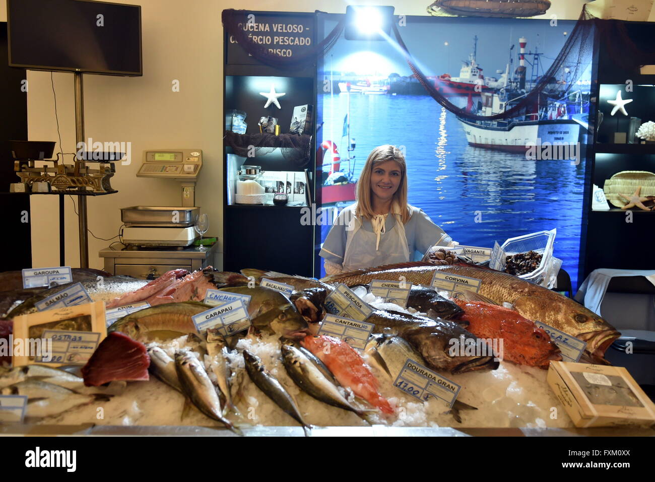 Lisbon, Portugal. 16th Apr, 2016. A seller stands behind a seafood stand at the Fish and Flavours foodie event in Lisbon, Portugal, April 16, 2016. The 9th edition of Fish and Flavours foodie event kicked off here on April 7, 2016, with a number of internationally renowned chefs participating. The event will end on April 17. © Zhang Liyun/Xinhua/Alamy Live News Stock Photo