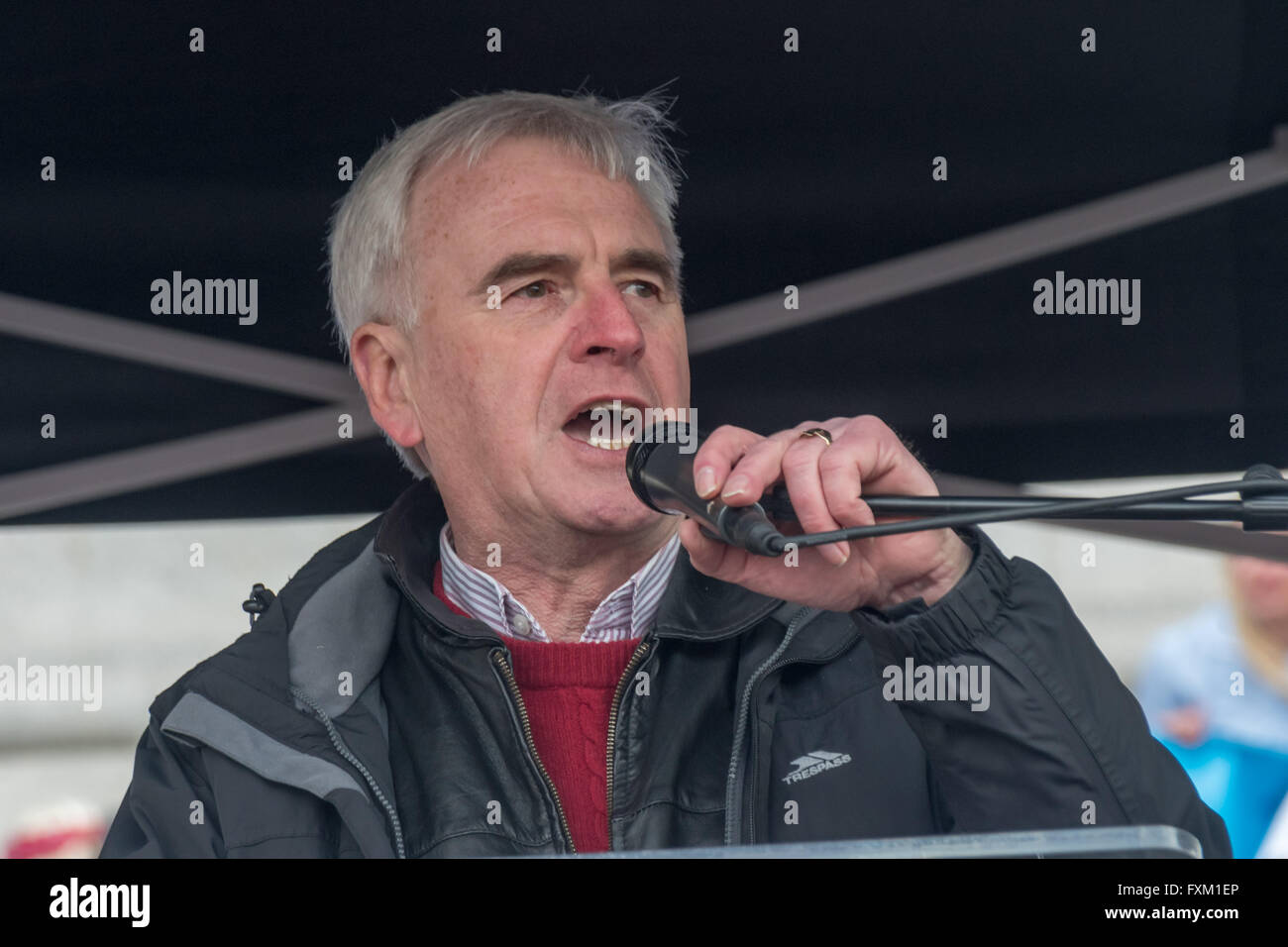 London, UK. 16th April, 2016. Shadow Chancellor John McDonnell speaking at the Trafalgar Square rally after the Peoples Assembly Against Austerity march demanding an end to privatisation of the NHS, secure homes for all, rent control and an end to attacks on social housing, an end to insecure jobs and the scrapping of the Trade Union Bill, tuition fees and the marketisation of education.  Peter Marshall/Alamy Live News Stock Photo