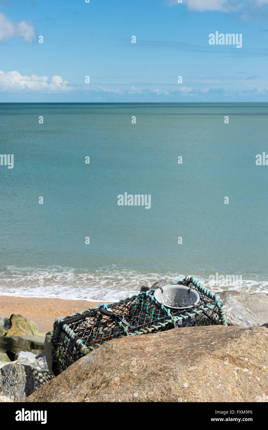 A crab pot or fishing creel on the shore at Beesands South Devon UK Stock Photo