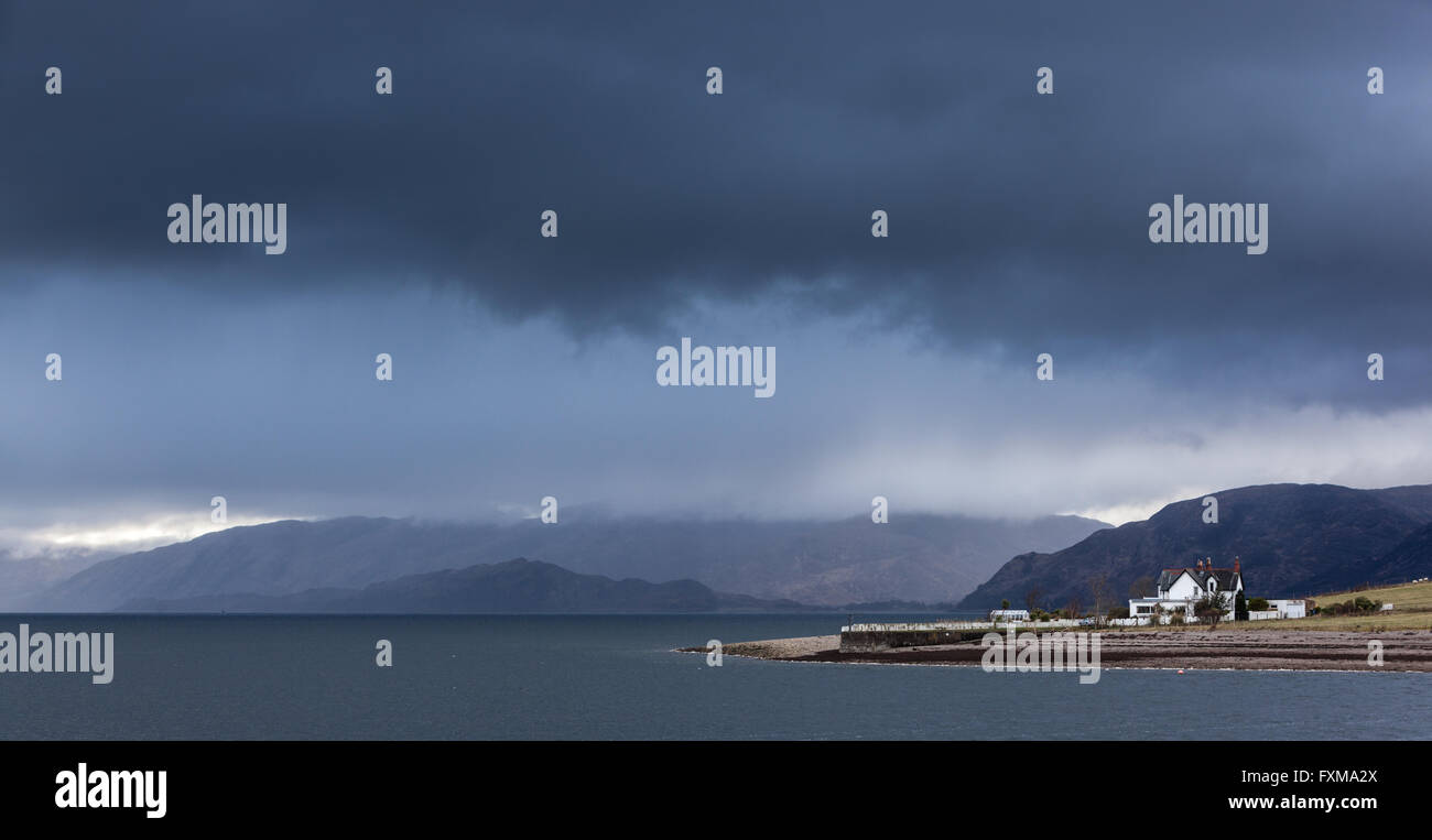 looking across Loch Linnhe to the Sunart Ardgour mountain range with a storm from covering them from Onich. Stock Photo
