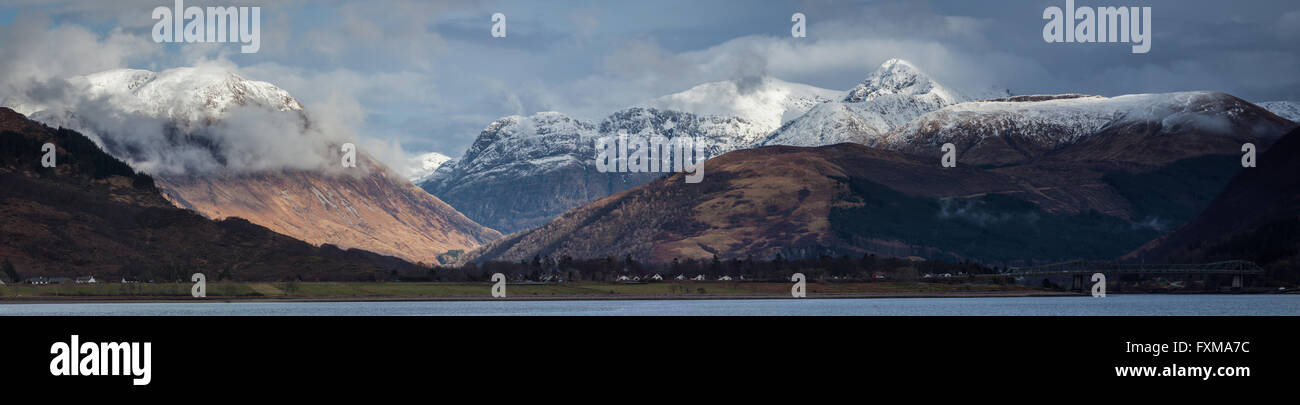 A panoramic from Onich looking toward Glencoe and the three sisters with snow capped summits Stock Photo