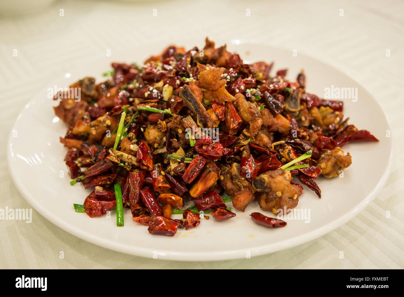 Sauteed Szechwan chili peppers and chicken Stock Photo