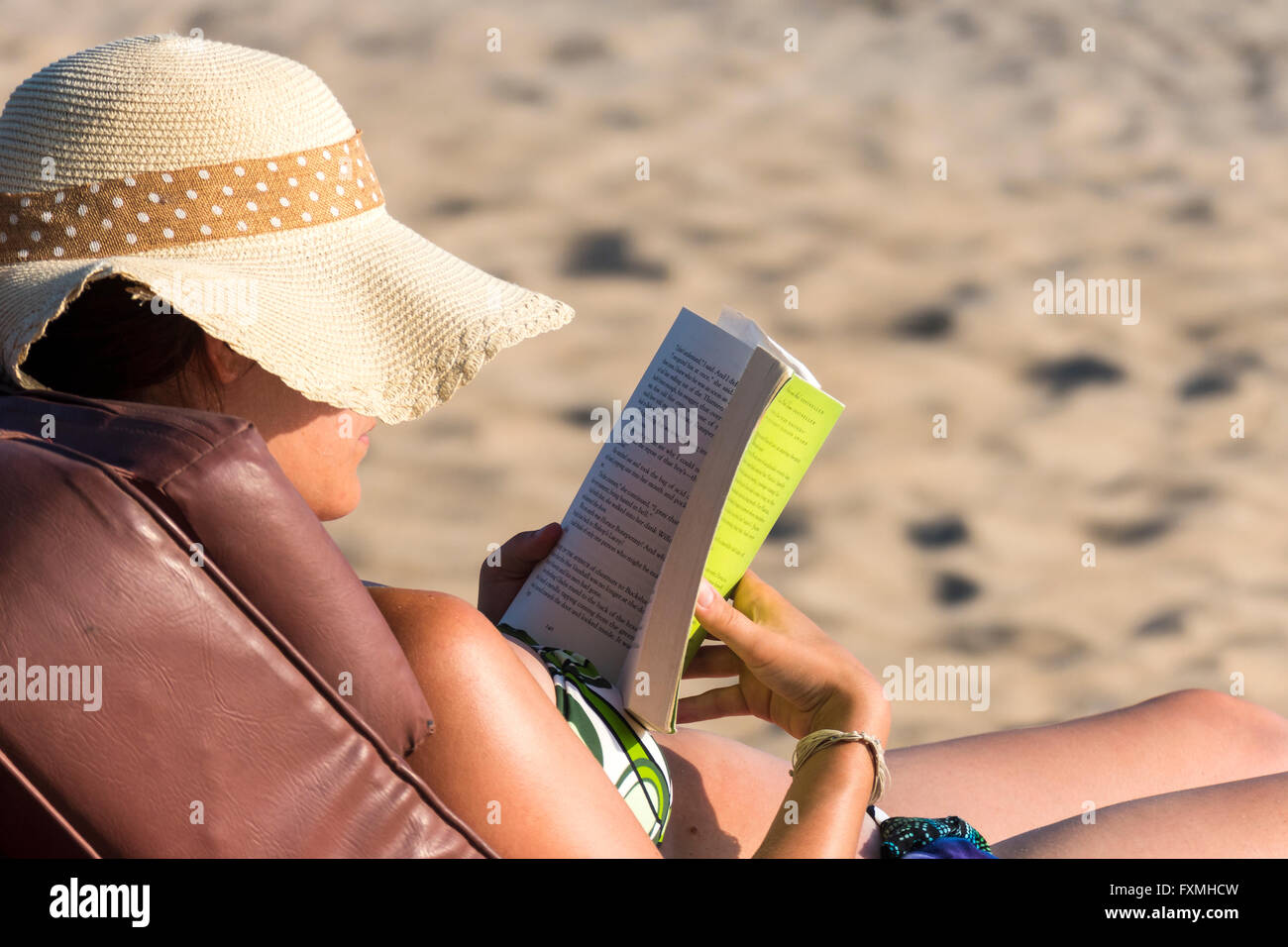 Reading on the beach chair hires stock photography and images Alamy