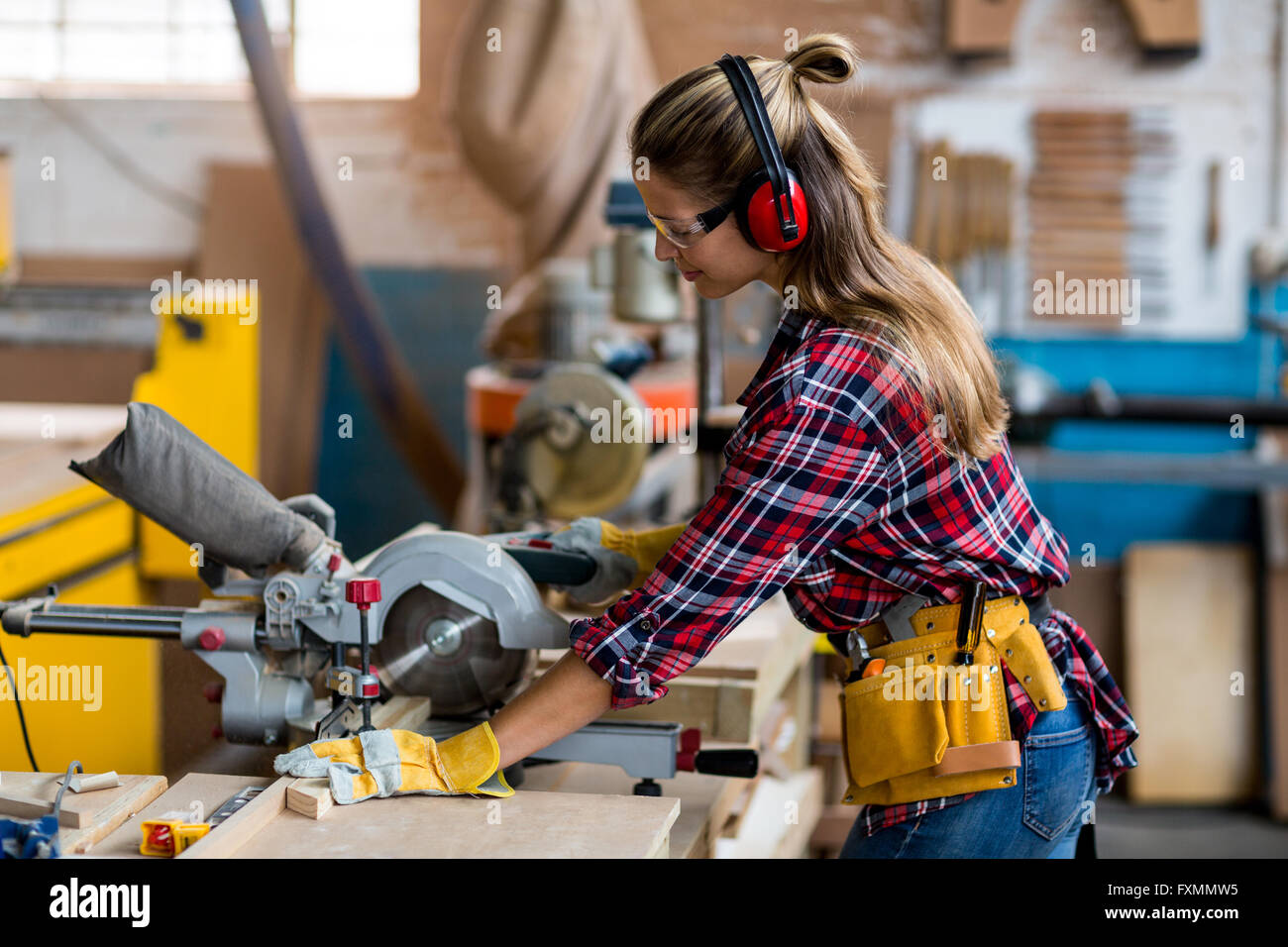 Carpenter cutting wooden plank hi res stock photography and images Alamy
