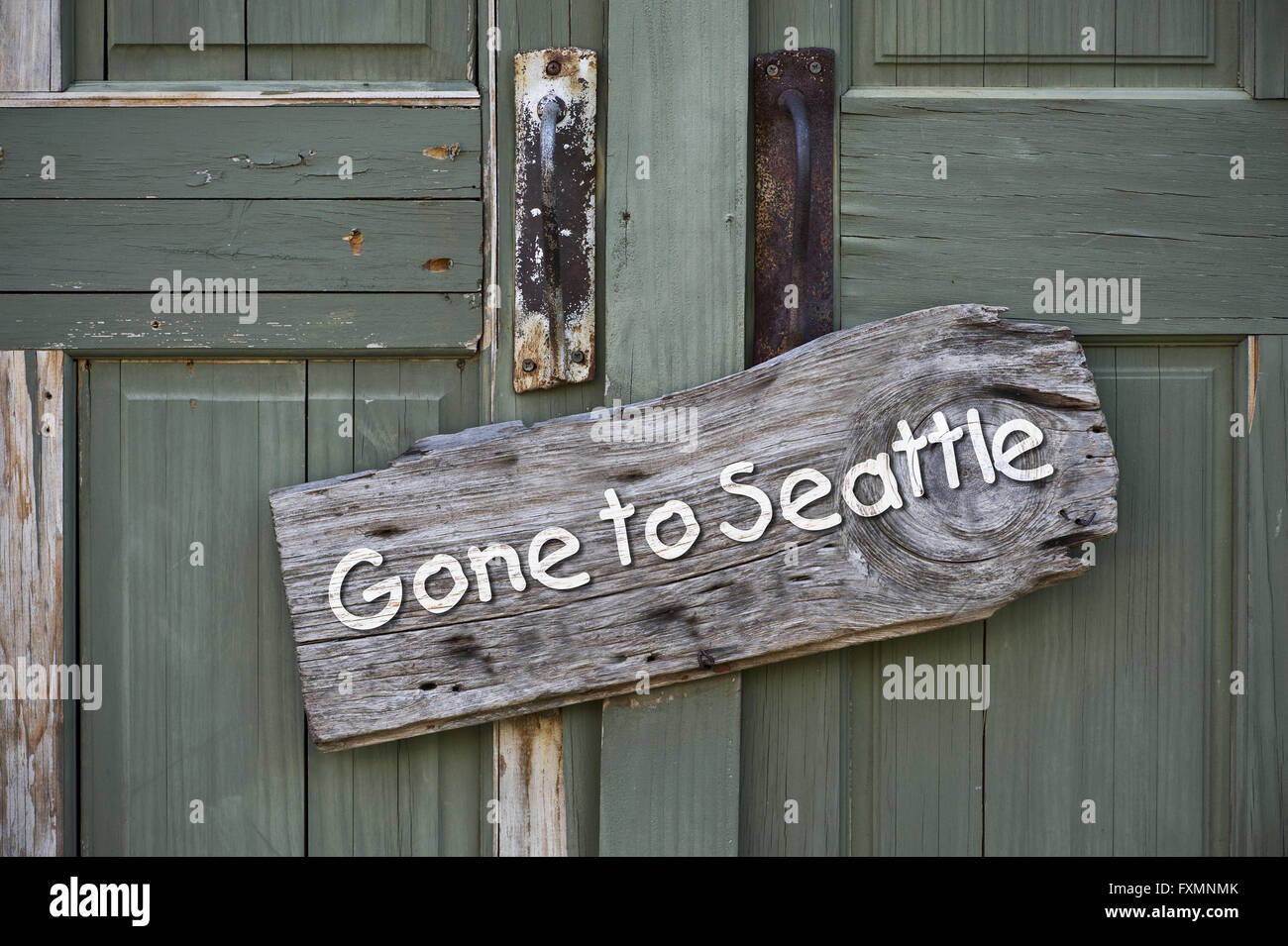 Gone to Seattle,USA sign on old green doors. Stock Photo