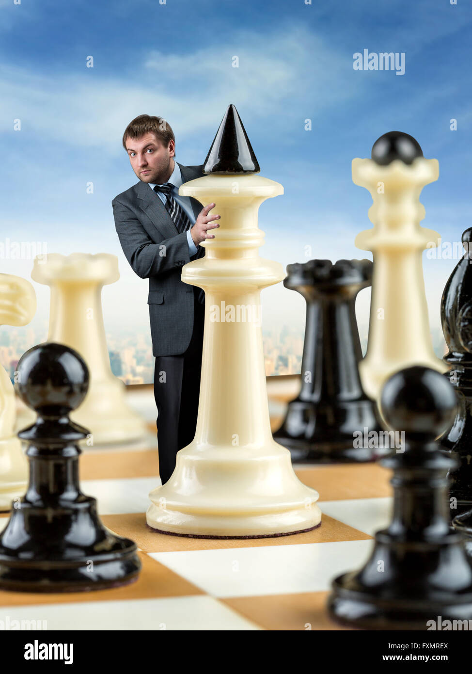 Chess game on chess board behind business man background. Business concept  to present financial information and marketing strategy analysis. Investmen  Stock Photo - Alamy