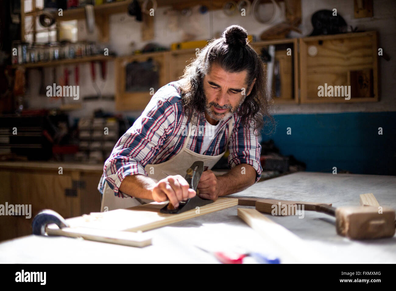 Male carpenter leveling timber jack hires stock photography and images