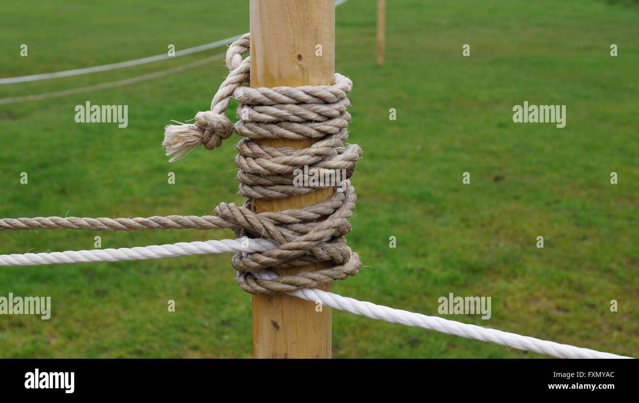 Rope tied around a wooden post Stock Photo Alamy