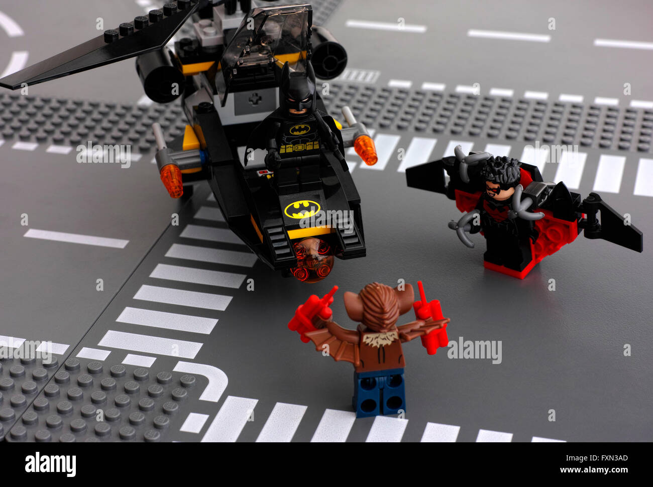 Tambov, Russian Federation - May 27, 2015 Lego Batman in Batcopter, Nightwing and Man-Bat on Lego road baseplates. Studio shot. Stock Photo