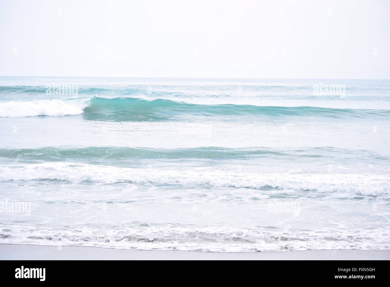 Clean Aqua Blue Wave Breaks Just OffShore Stock Photo