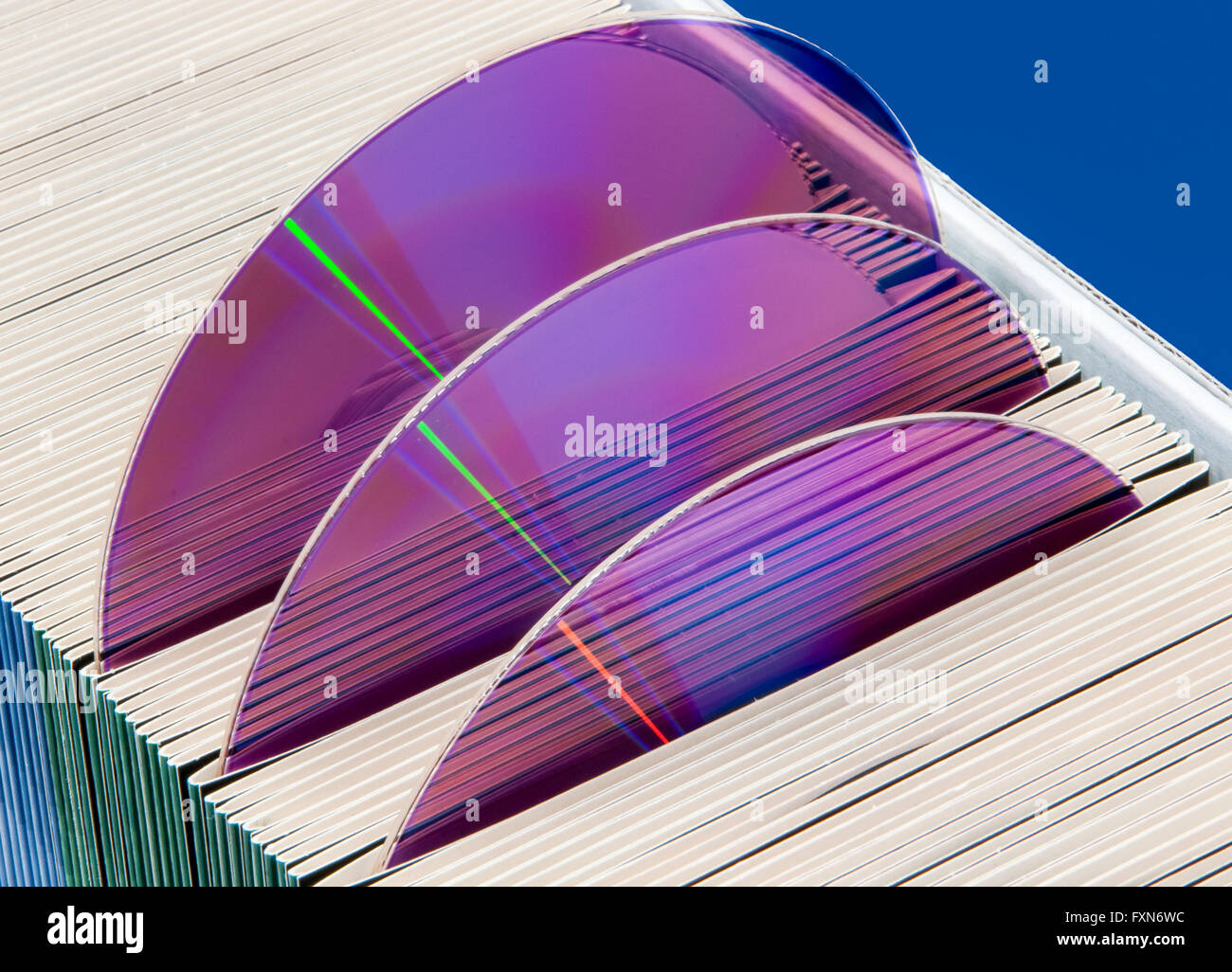 Three CDs or DVDs in colorful paper sleeves Stock Photo Alamy