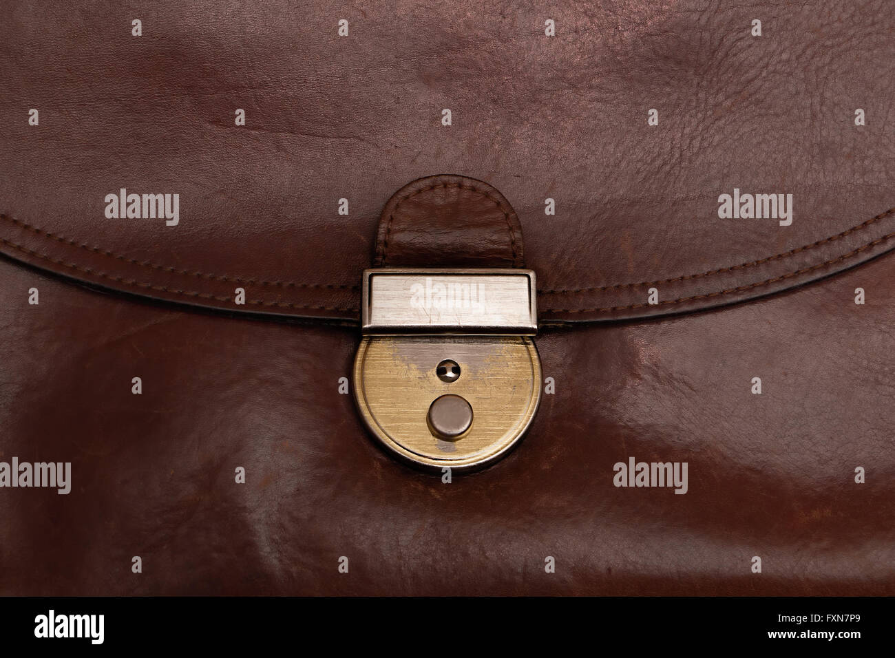 Detail of old grunge brown leather bag or briefcase Stock Photo