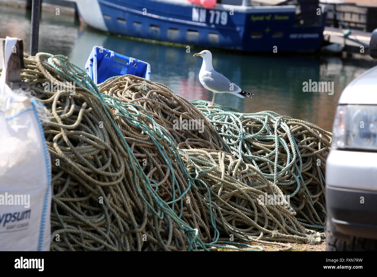 large fishing nets in fishing boat at the pier in italy Stock