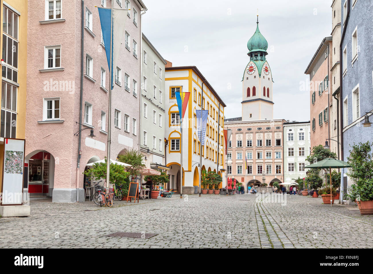 Colorful buildings in the center of Rosenheim and tower of Sankt Nikolaus Church, Germany Stock Photo