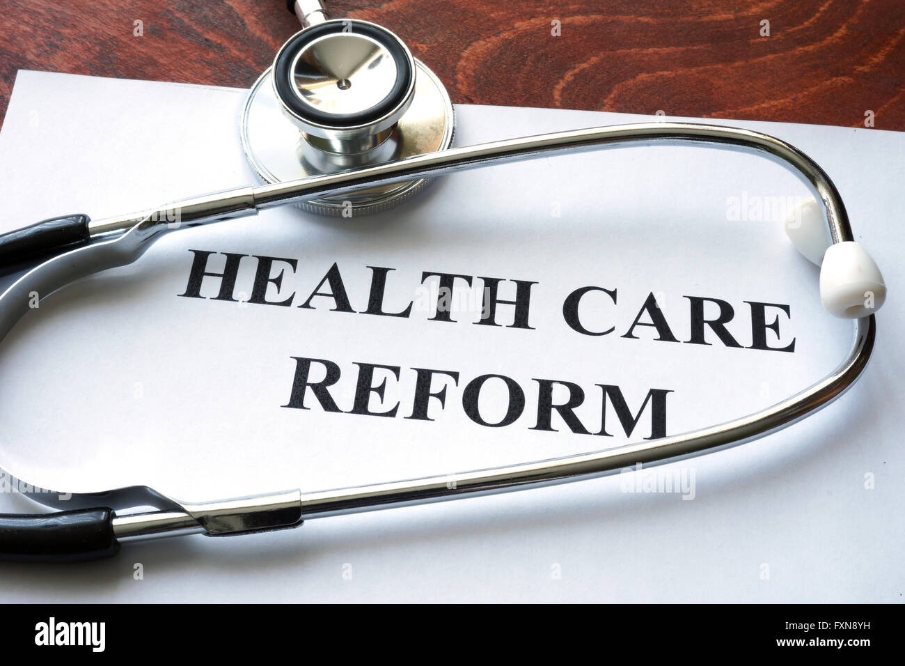 Words healthcare reform written on a paper. Stock Photo