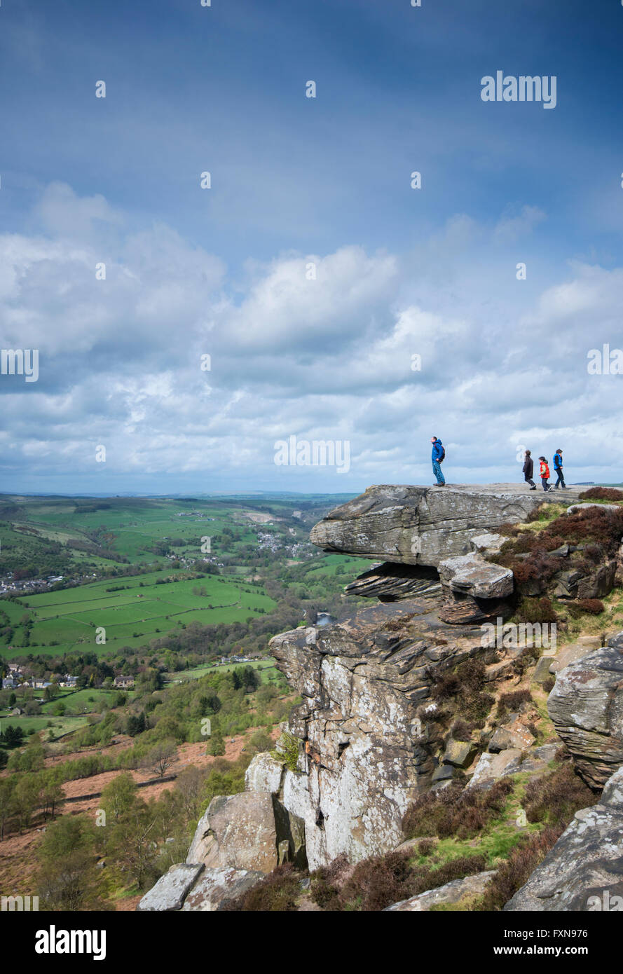 Hikers on Curbar Edge in the Peak District National Park in Derbyshire, England, UK Stock Photo