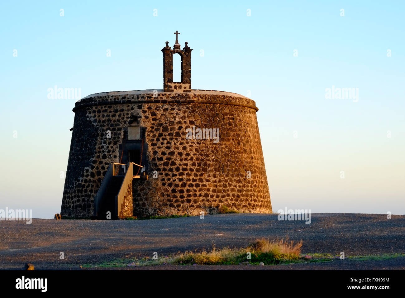 a view of the Castillo de las Coloradas, Playa Blanca, Lanzarote bathed in warm evening sunlight Stock Photo