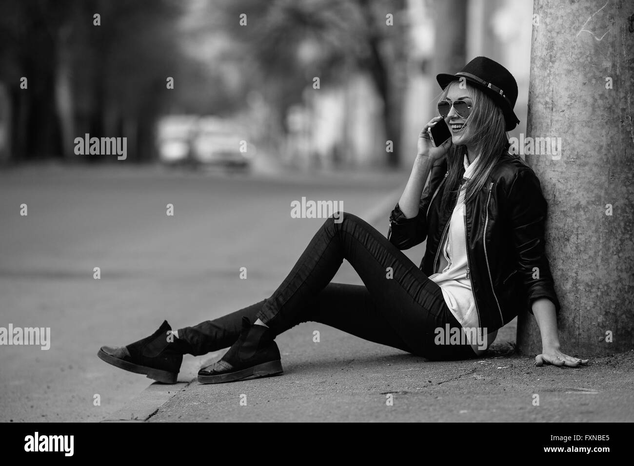 Photo of a young beautiful woman on the city street Stock Photo - Alamy