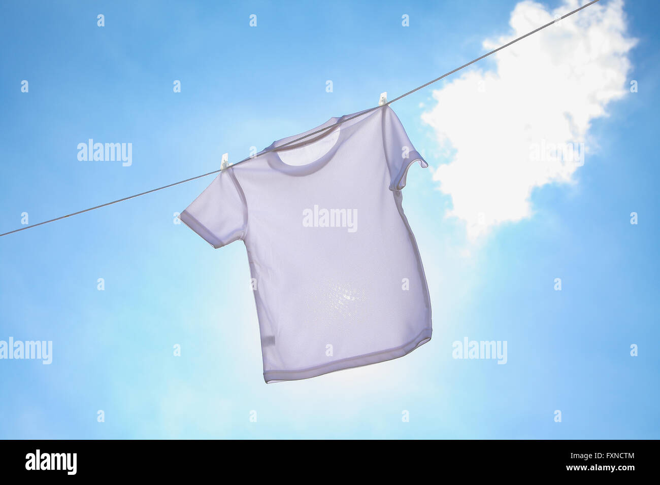 Laundry hanging against blue sky Stock Photo