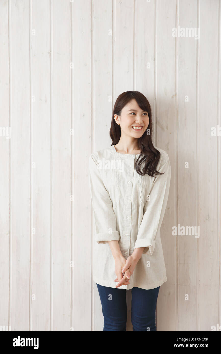 Woman against the wall hi-res stock photography and images - Alamy