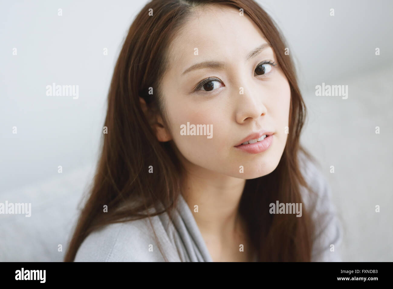 Face young serious asian woman hi-res stock photography and images - Alamy