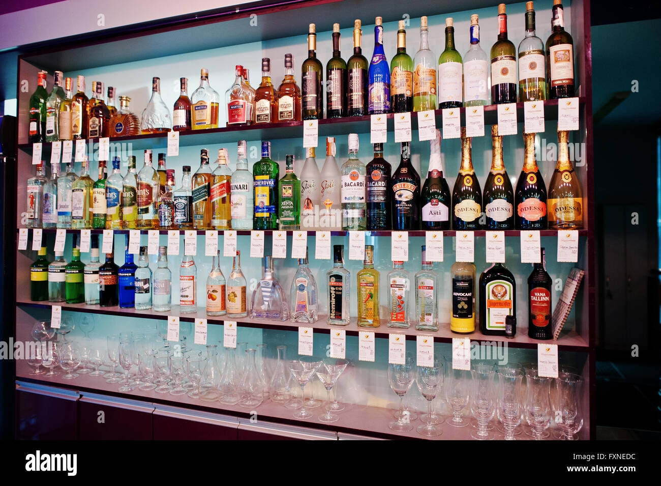 KYIV, UKRAINE - MARCH 25, 2016: Various alcoholic beverages bottles in the bar on the shelf. Stock Photo