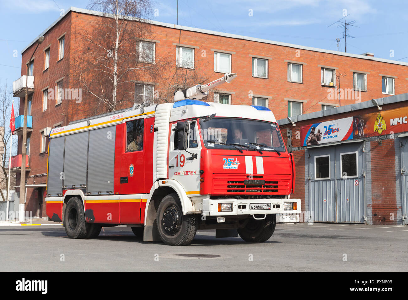 St. Petersburg, Russia - April 9, 2016: Kamaz 43253 truck, red Russian fire engine modification near Fire Department garage Stock Photo
