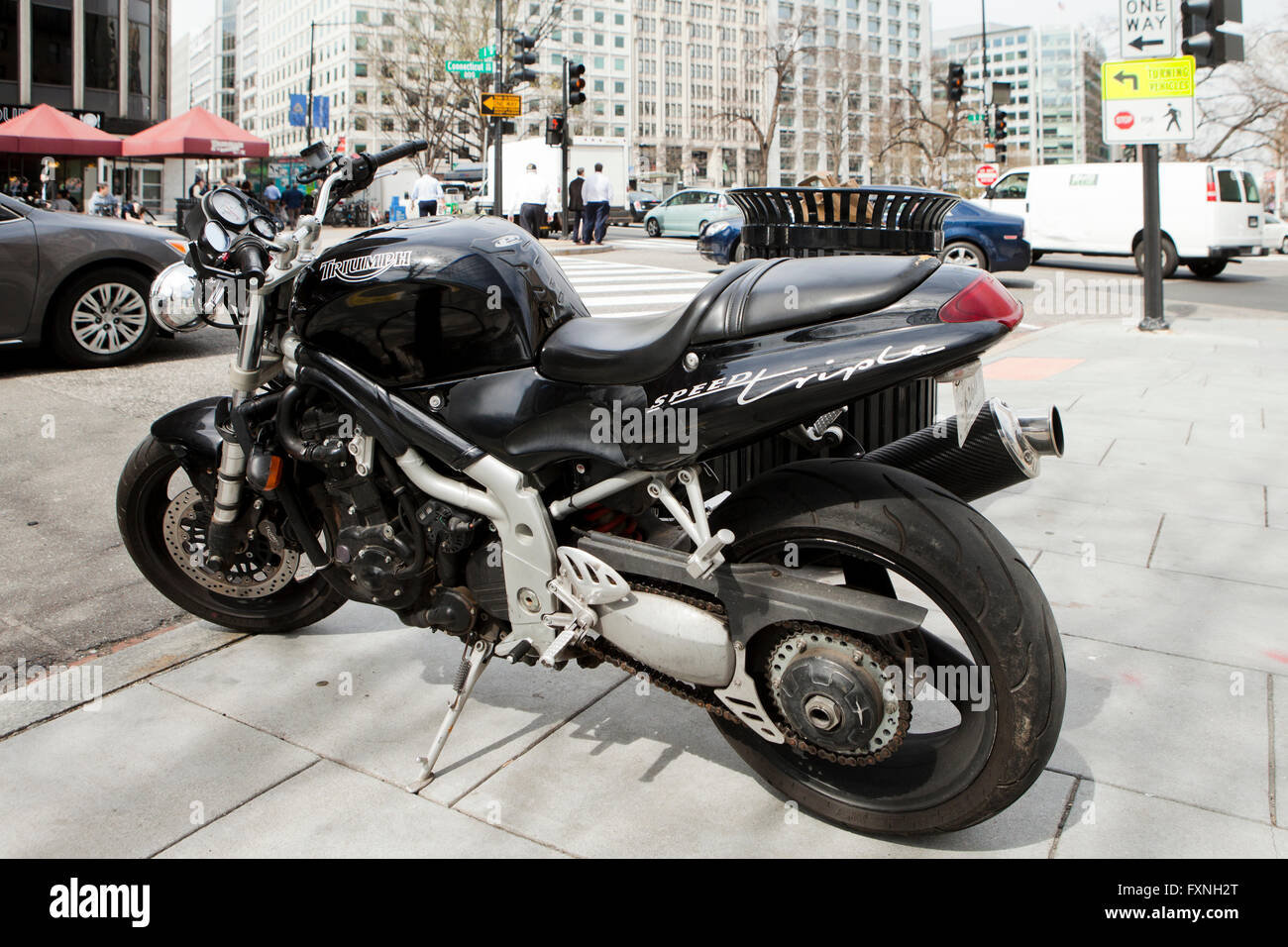 Triumph Speed Triple motorcycle parked on sidewalk - Washington, DC USA Stock Photo