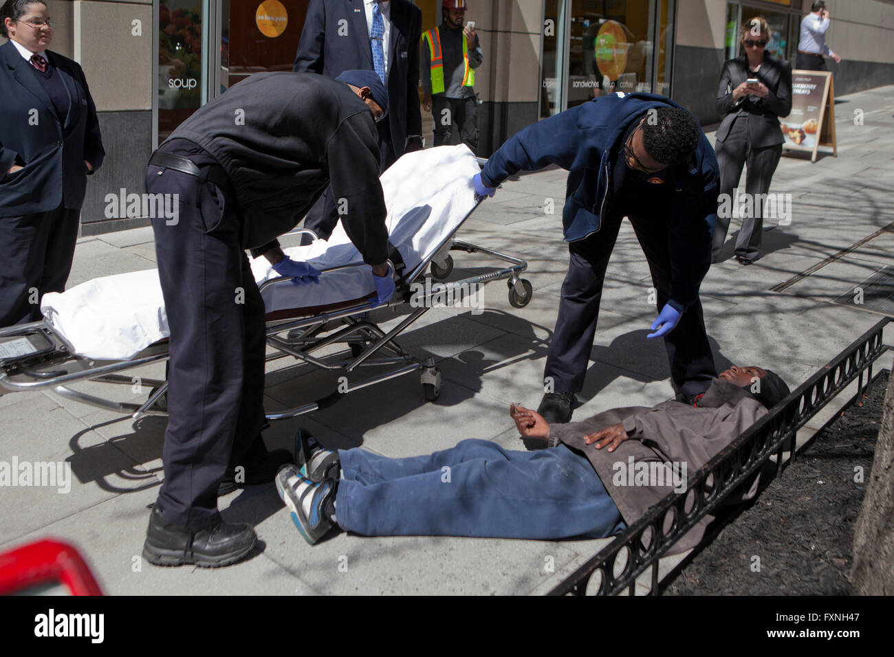 DC Fire & EMT team respond to a person in distress on sidewalk - Washington, DC USA Stock Photo