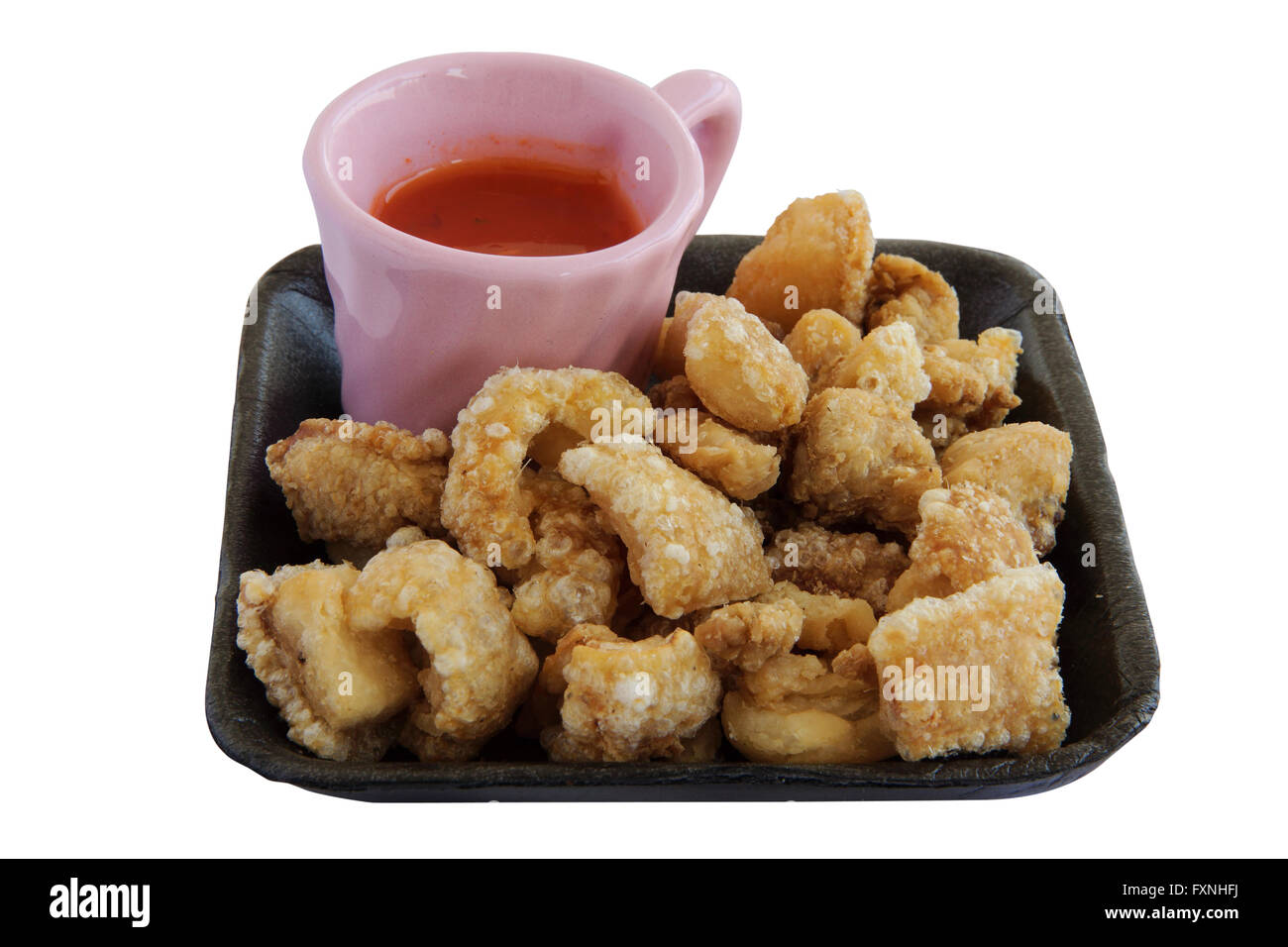 fried pork rinds with sauce. snack food in Thailand Stock Photo