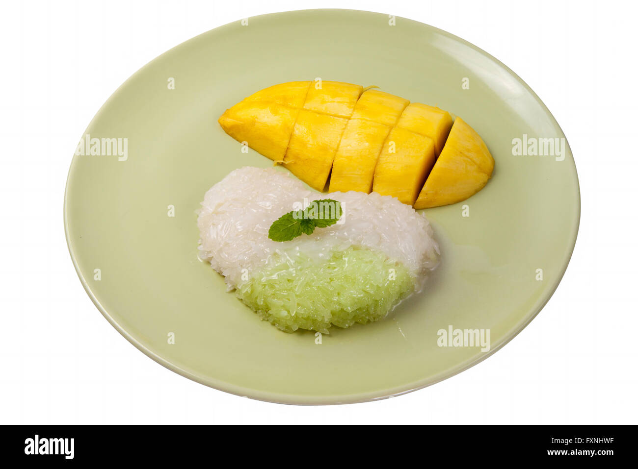 Sticky rice cooked in sweetened thick coconut milk, served with slices of ripe mango. Thai Dessert Sweet. Stock Photo